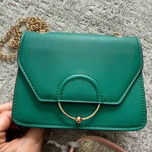 Like new Green Crossbody Bag with Gold Ring Accent